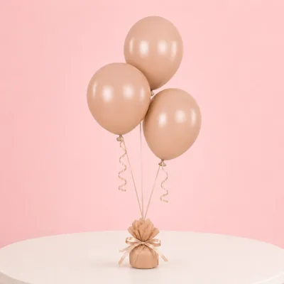 Peach party balloons arranged as a trio for special occasions.