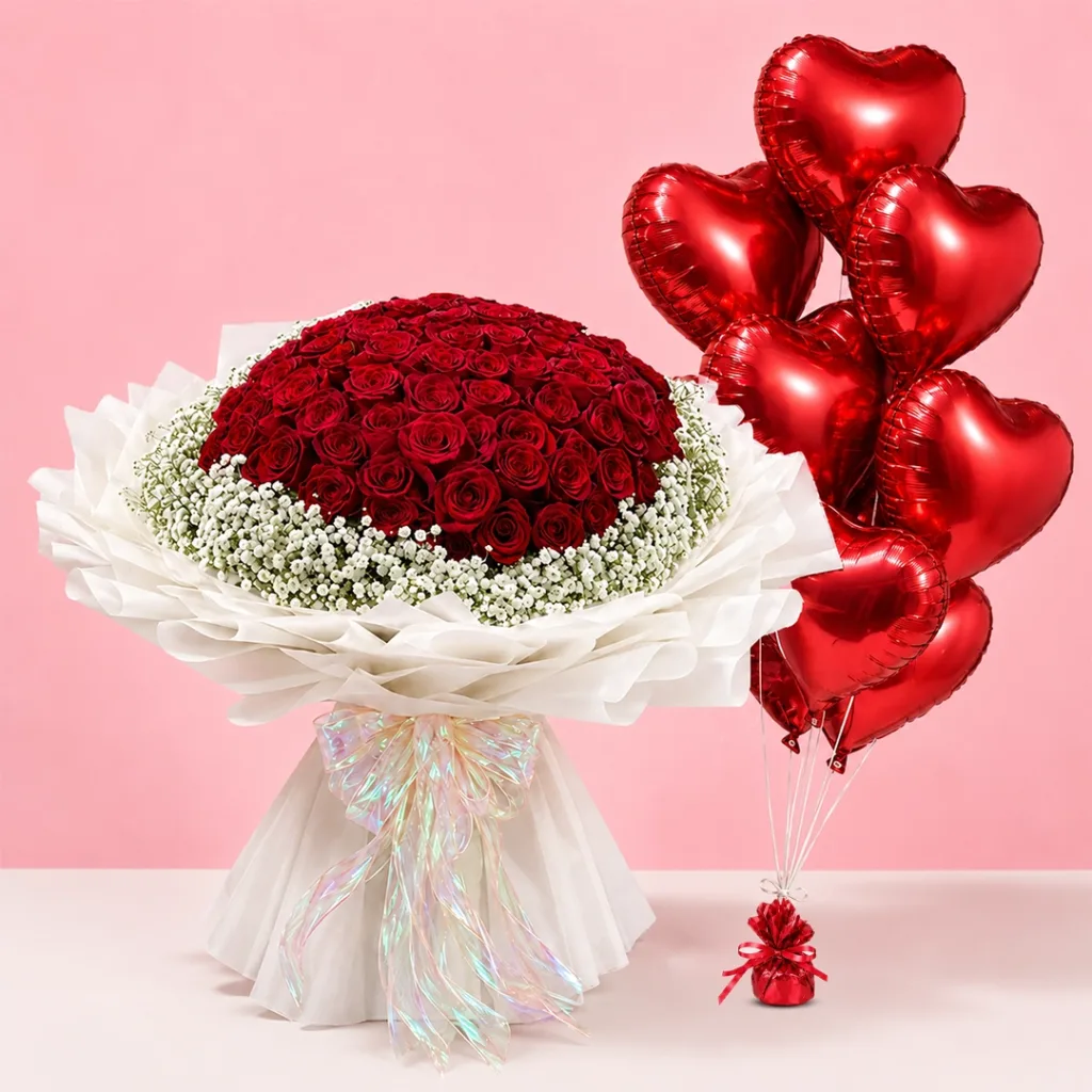Red Roses & Heart Balloon Bouquet featuring fresh red roses arranged with vibrant red heart-shaped balloons in a romantic floral display.
