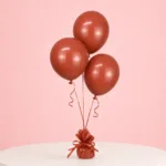 Premium terracotta balloons arranged as a trio for elegant event decorations.
