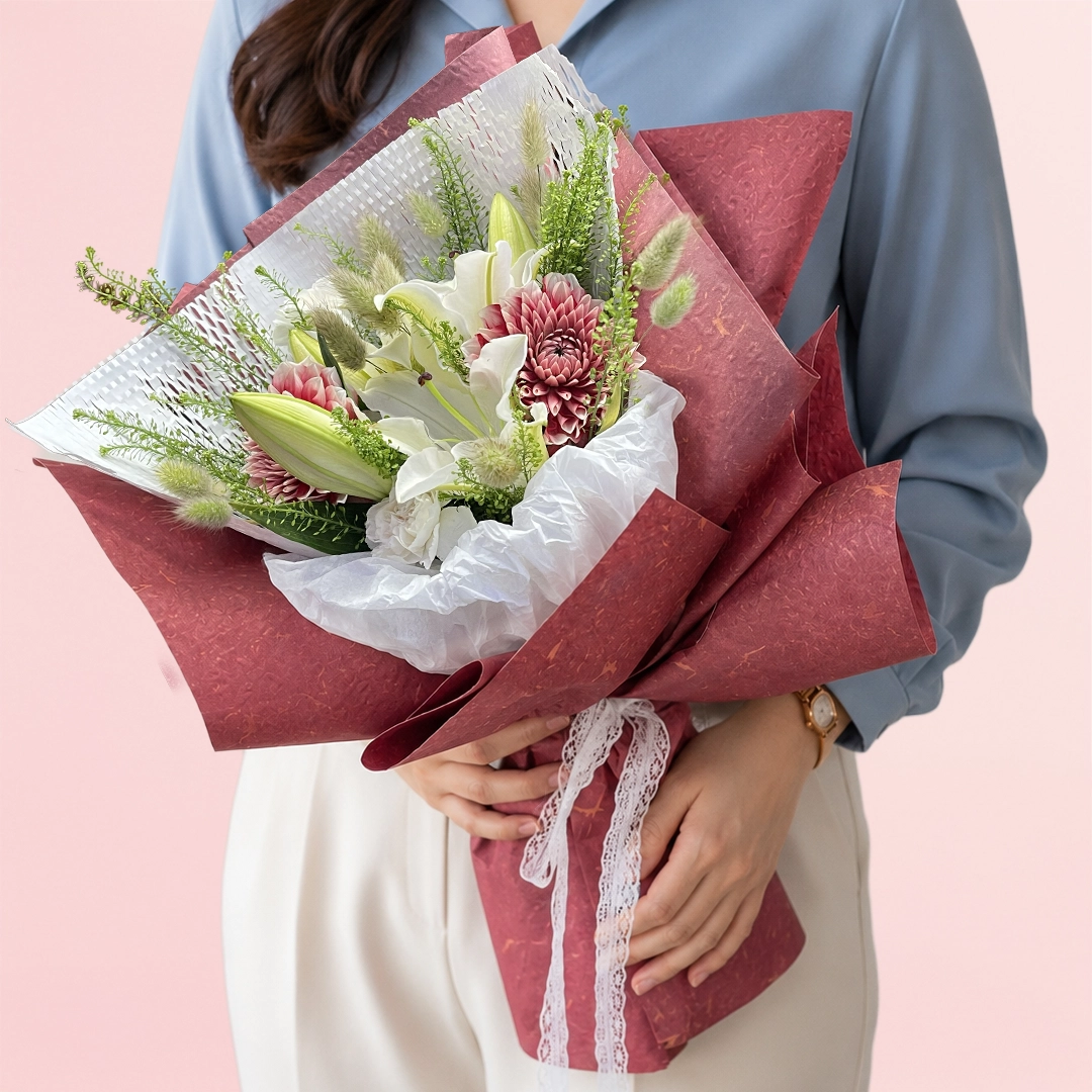 white-lilies-bloom-story Fresh oriental white lilies and white lisianthus complemented by a pink carnation in a beautifully handcrafted bouquet.